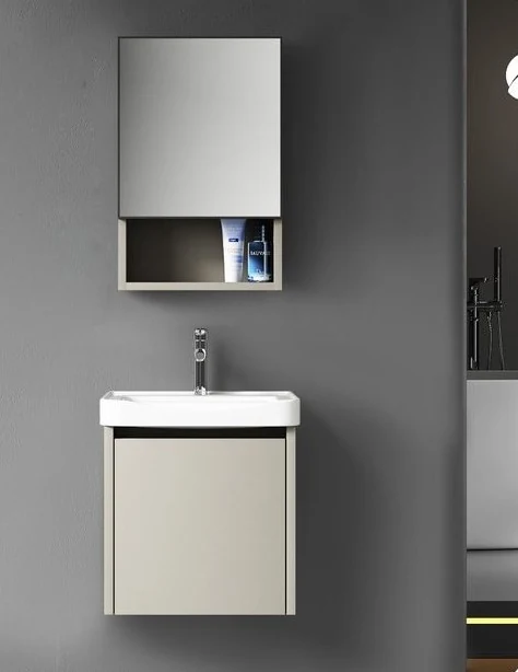 Wall-mounted vanity with integrated basin and mirrored storage against a charcoal wall